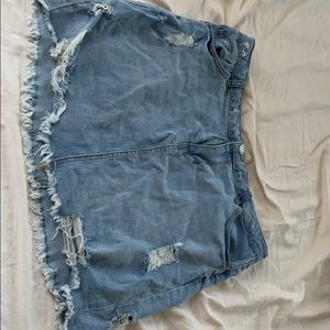 Distressed XlL denim jean mini skirt